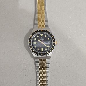 Timex Black and Gold Watch with Luminous Markers